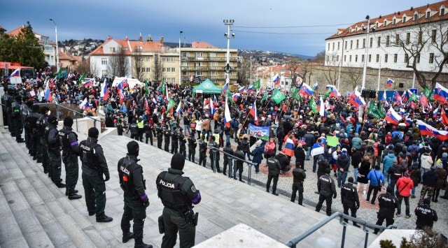 Thousands of Slovaks rally to protest a defense military treaty between this NATO member and the United States, in Bratislava, Slovakia, Tuesday, Feb. 8, 2022. (Pavol Zachar/TASR via AP)

