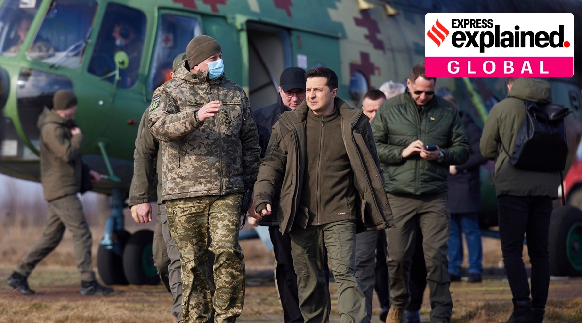 Ukrainian President Volodymyr Zelenskyy (centre) arrives to attend a military drill outside the city of Rivne, northern Ukraine, February 16, 2022 (Ukrainian Presidential Press Office via AP)
