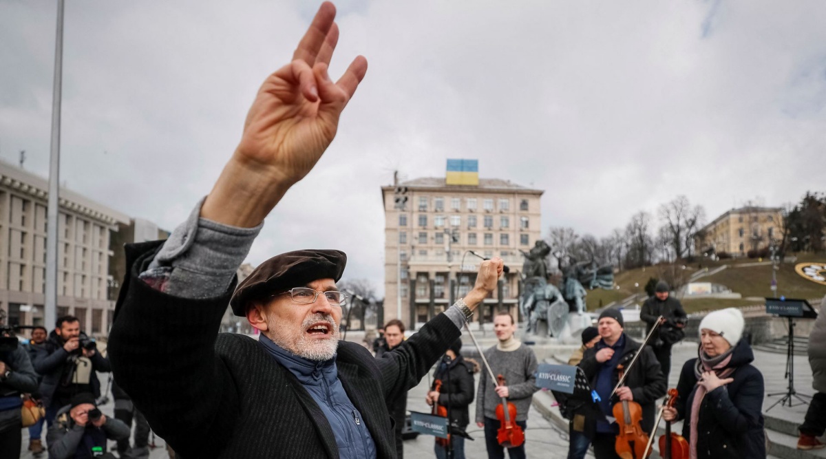 Conductor Herman Makarenko performs during an open-air concert named "Free Sky" at the Independence Square in central Kyiv, Ukraine March 9, 2022. REUTERS/Gleb Garanich