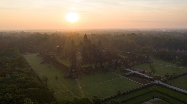 An aerial view of the ancient temple complex of Angkor Wat in Siem Reap, Cambodia at sunrise. Cambodia has been open to foreign tourists for months, but in this time of COVID-19, few have made the trip. (Thomas Cristofoletti/The New York Times)