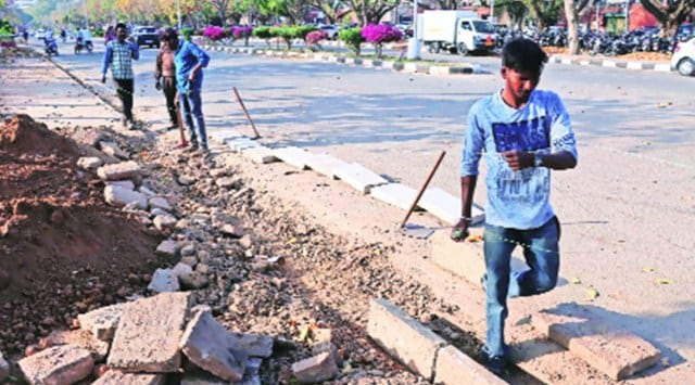 The beautification drive includes repainting road berms in  yellow and black which were earlier painted white and black, installation of new grills at broken or missing sites and painting the old ones. 
Kamleshwar Singh and (Photo by Hina Rohtaki/File)