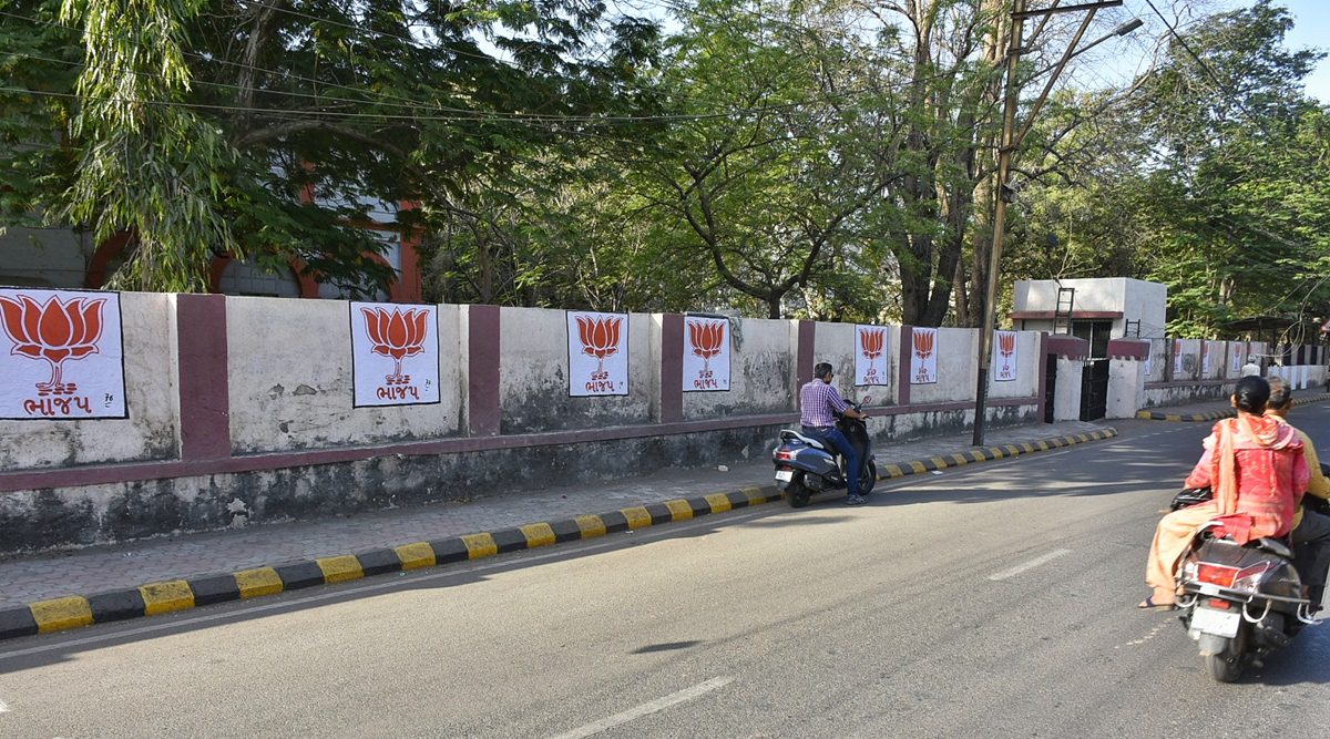 Lotus symbol of the BJP painted on wall of the offices of the R&B department, in Rajkot on Tuesday. (Express Photo by Chirag Chotaliya)