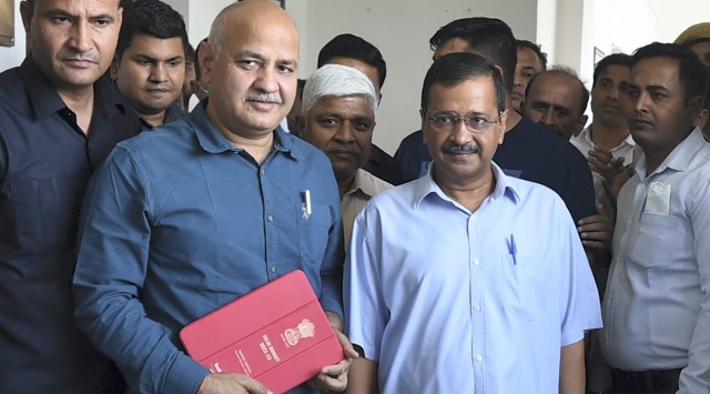 Delhi Dy CM and Finance Minister Manish Sisodia with CM Arvind Kejriwal before presenting the annual budget 2022-23 in Delhi Assembly, in New Delhi. (Photo: PTI)