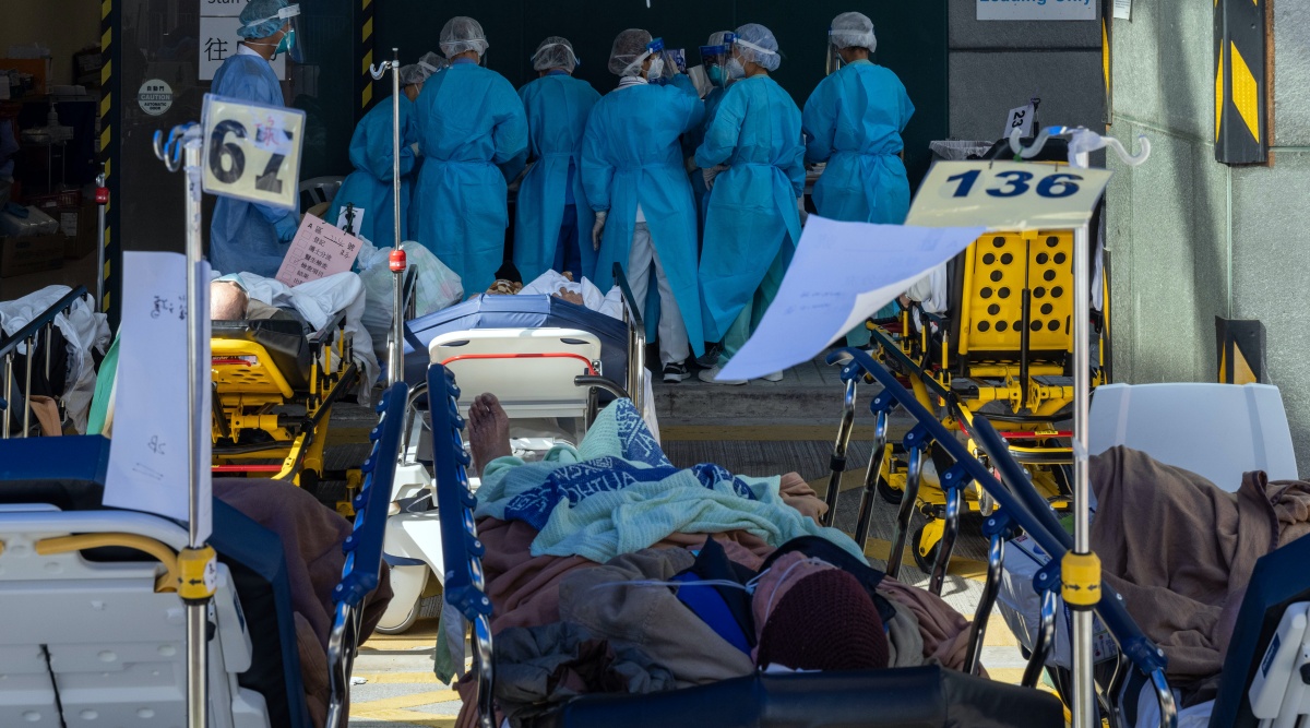 Patients outside a temporary triage area at the Caritas Medical Center in Hong Kong on Feb. 28, 2022.  (Billy H.C. Kwok/The New York Times)