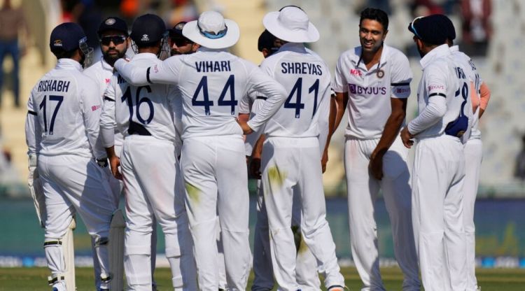 Indian players celebrate the dismissal of Sri Lanka's Lahiru Thirimanne during the second day of the first test match between India and Sri Lanka in Mohali, India, Saturday, March 5, 2022. (AP Photo/Altaf Qadri)
