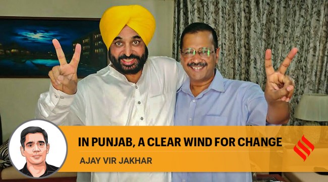 Delhi Chief Minister and AAP convener Arvind Kejriwal and AAP's Chief Ministerial candidate Bhagwant Mann flash the victory sign, as the party heads to a landslide victory in Punjab Assembly elections. (PTI Photo)
