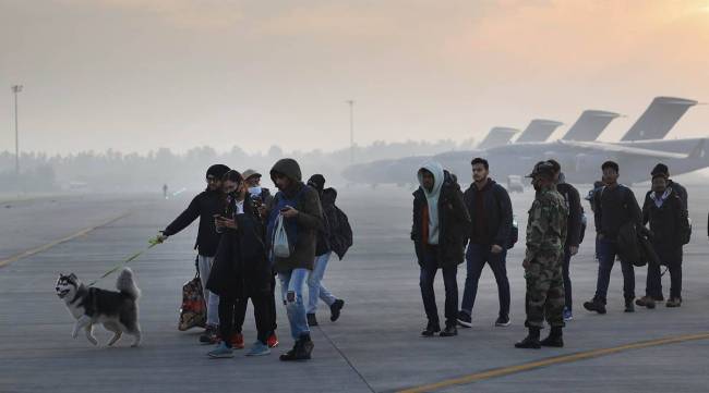 Students who were evacuated from Ukraine arrive at the Hindon IAF airbase in Ghaziabad on Thursday. (Express photo by Praveen Khanna)