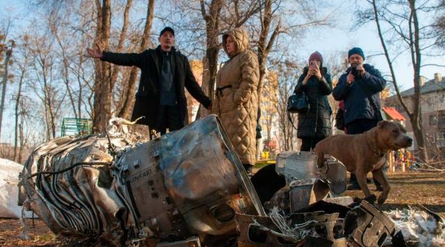 In Ukraine, the human toll was mounting in Kharkiv, a city of 1.5 million people, where bombing has left its centre a wasteland of ruined buildings and debris. (AP)