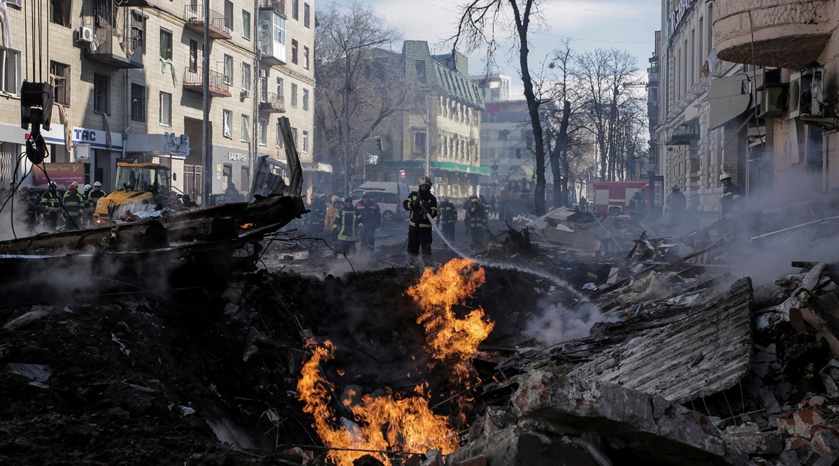 Firefighters extinguish flames outside an apartment after a Russian rocket attack in Kharkiv. (Photo: AP)
