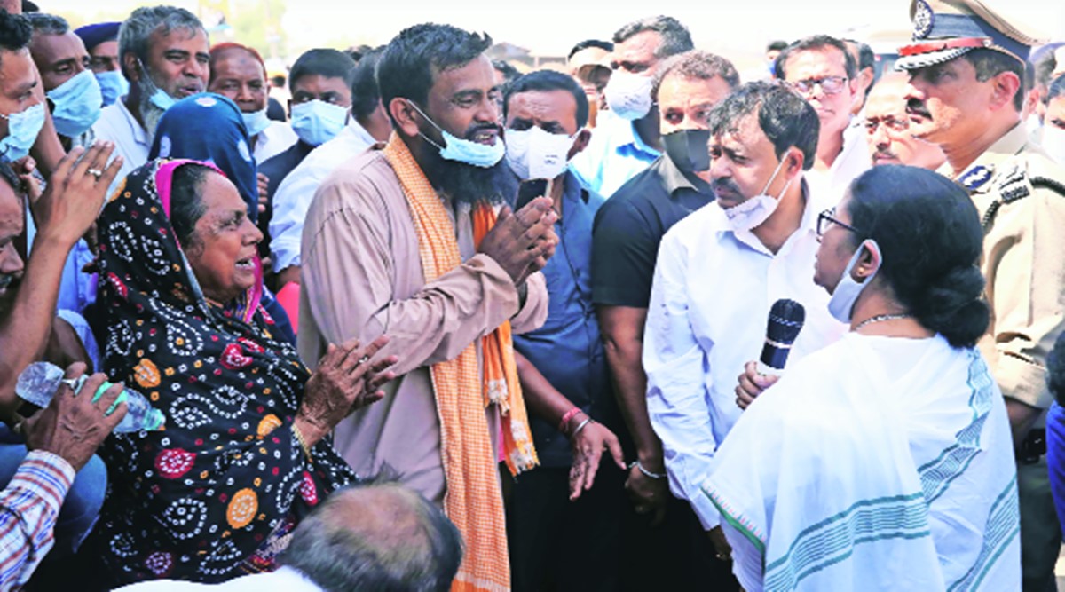 West Bengal CM Mamata Banerjee with victims’ families at Bogtui village in Birbhum district, on Thursday. (Express Photo)