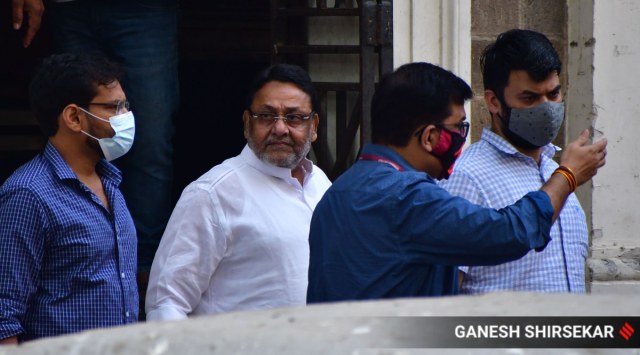 NCP leader Nawab Malik is taken to court from the ED office in Mumbai. (Express Photo: Ganesh Shirsekar, File)