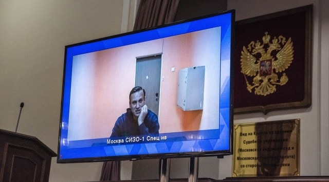 Russian opposition leader Alexei Navalny, shown on a screen while in detention during a court hearing last year in Moscow, Jan. 28, 2021. (Sergey Ponomarev/The New York Times)