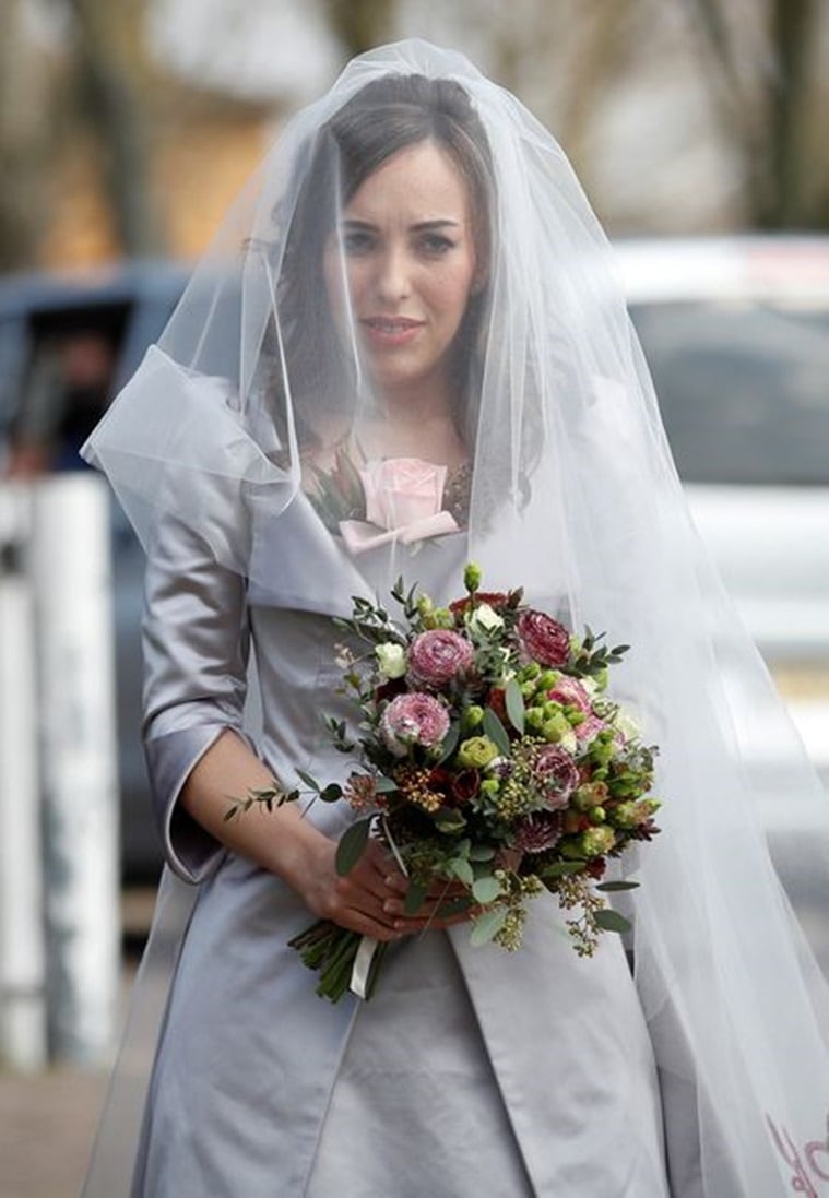 Stella Moris looks stunning in lilac dress for wedding with Julian