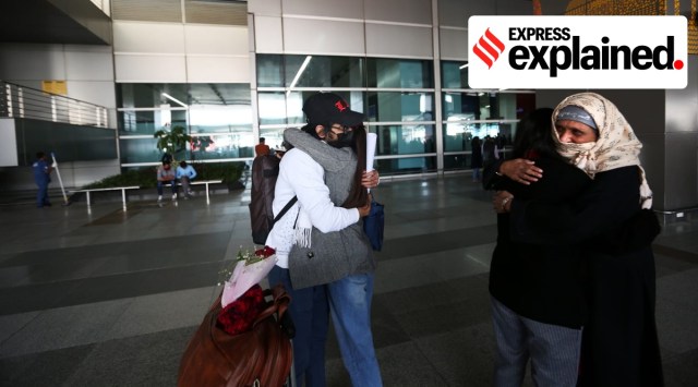 Family members hug their children after their return from Ukraine. (Express Photo by Gajendra Yadav) 
