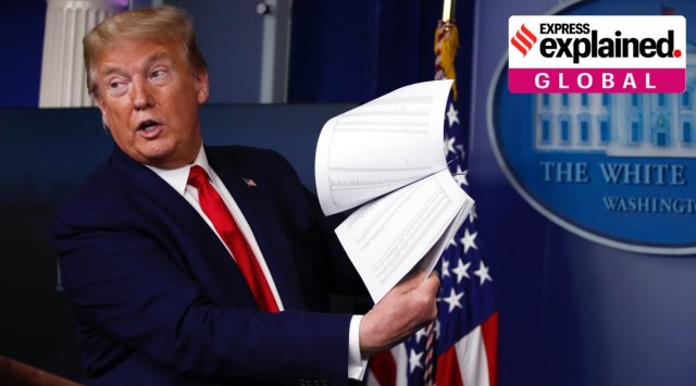 President Donald Trump holds up papers as he speaks in the James Brady Press Briefing Room of the White House on April 20, 2020, in Washington. (AP Photo/Alex Brandon, File)

