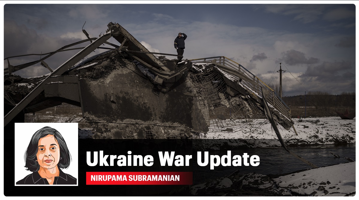 A man stands atop a destroyed bridge in Irpin, on the outskirts of Kyiv on Tuesday. (Photo: AP)