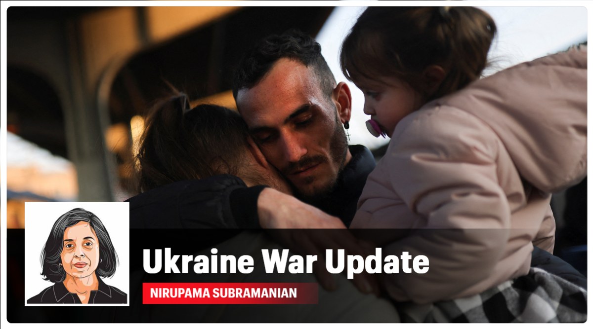 A Ukrainian refugee says goodbye to his wife and daughter before they board a train for Budapest. (Reuters Photo: Edgard Garrido)
