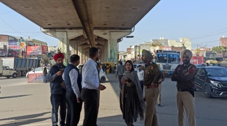 Dera Bassi SDM along with other officials inspect a road in Zirakpur on Friday. (Express Photo)