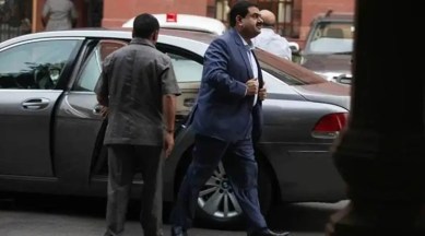 Indian Businessman Gautam Adani boards flight after getting off his BMW  7-Series