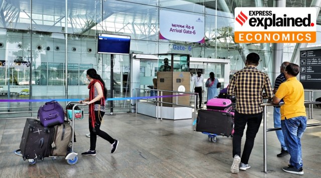 Passengers exit from the arrivals gate of the international terminal of Sardar Vallabhbhai Patel International airport, Ahmedabad. (Express Photo: Nirmal Harindran)