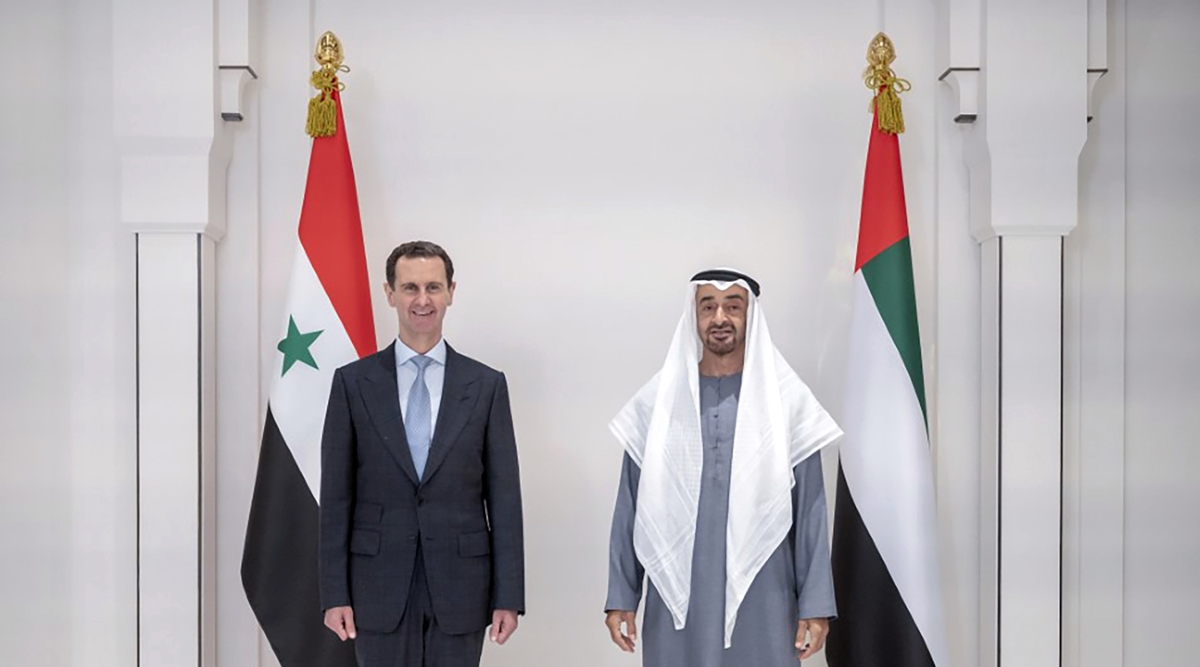 In this photo released by the Emirates News Agency, WAM, Abu Dhabi's Crown Prince, Sheikh Mohammed bin Zayed Al Nahyan, right, and Syrian President Bashar Assad pose for a photo during their meeting in Abu Dhabi, United Arab Emirates, March 18, 2022. (AP)
