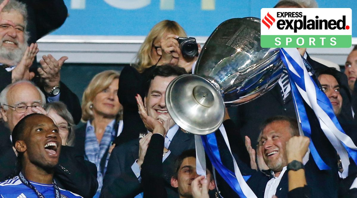 Chelsea owner Roman Abramovich holds up the trophy at the end of a Champions League final in 2012. Abramovich has confirmed he is trying to sell the Premier League club he turned into an elite trophy-winning machine with his lavish investment. (AP Photo/Matt Dunham, File)
