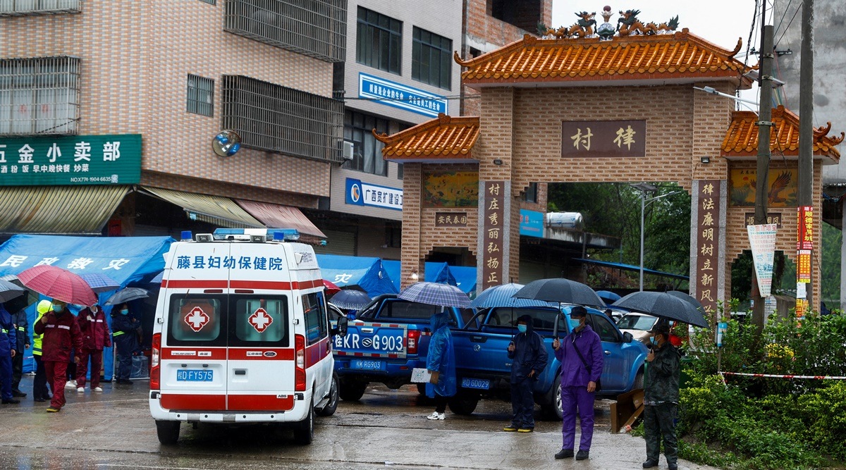 An ambulance arrives at the entrance of Lu village near the site where a China Eastern Airlines Boeing 737-800 plane flying from Kunming to Guangzhou crashed, in Wuzhou, Guangxi Zhuang Autonomous Region, China March 23, 2022. (Reuters)