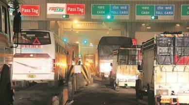 A toll plaza with a FASTag banner. Amazon Pay and ICICI have partnered to offer a new co-branded FasTag