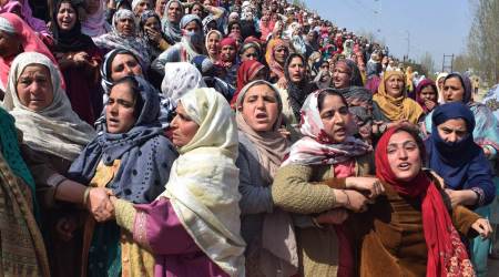 At the funeral of Special Police Officer Ishfaq Ahmad and his brother Umar Jan in Chadbugh village, Budgam. (Shuaib Masoodi)