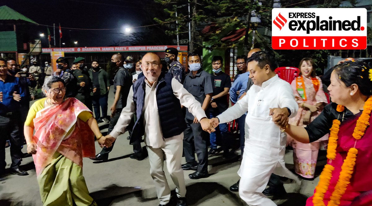 Chief Minister N Biren Singh and Manipur BJP chief A Sharda Devi dance in celebrations after the party's victory in Assembly polls, in Imphal, Thursday, March 10, 2022. (PTI Photo) 