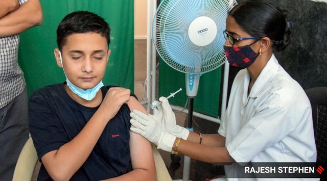 A boy receives a dose of Covid vaccine during a vaccination drive organised for children, in Thergaon PCMC on Wednesday (Express photo by Rajesh Stephen)