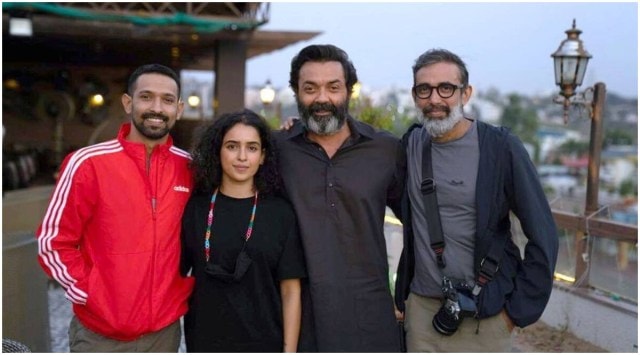 Love Hostel Shanker Raman poses with his actors Bobby Deol, Sanya Malhotra and Vikrant Massey. (Photo: ZEE5)