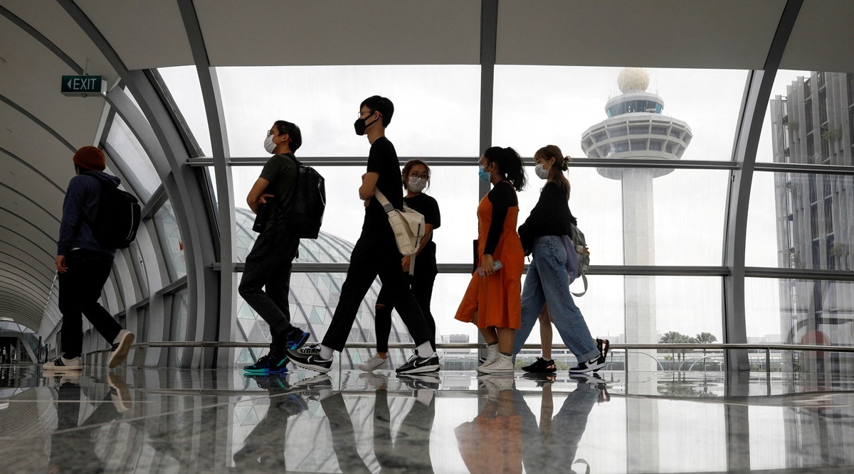 People pass the control tower of Singapore's Changi Airport, Singapore. (File/Reuters)