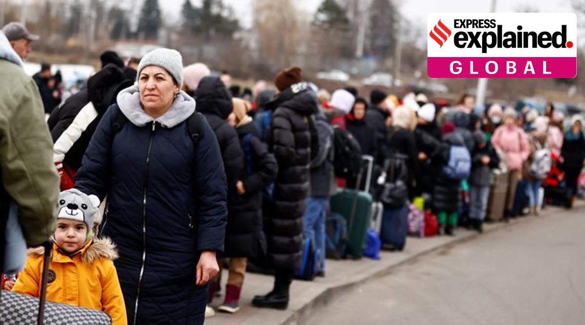 People wait to board a bus after fleeing the Russian invasion of Ukraine, at the border checkpoint in Medyka, Poland, March 4. (Reuters)