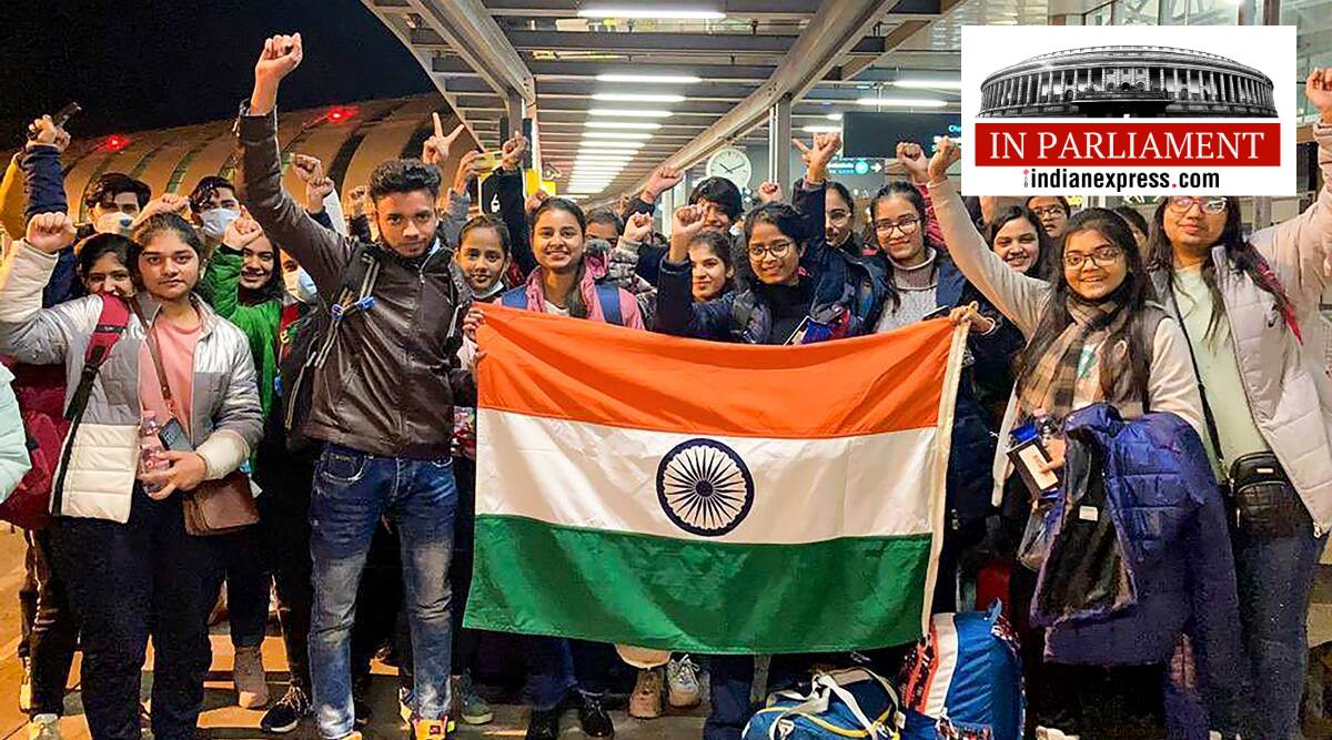 Indian nationals hold the tricolour before boarding a special Air India flight, evacuating Indians from war-torn Ukraine, in Budapest. (PTI Photo/File)