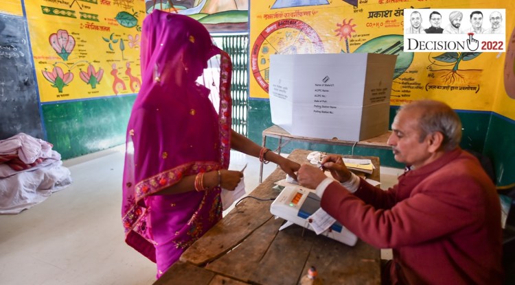 A woman gets her finger marked with indelible ink after casting her vote for the seventh and last phase of UP Assembly elections at a polling centre, in Badhoi. (PTI)