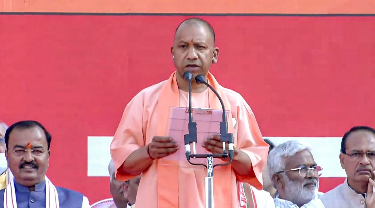 BJP leader Yogi Adityanath takes oath as Uttar Pradesh Chief Minister for the second consecutive term, in Lucknow on Friday. (PTI/ Twitter @BJP4India)
