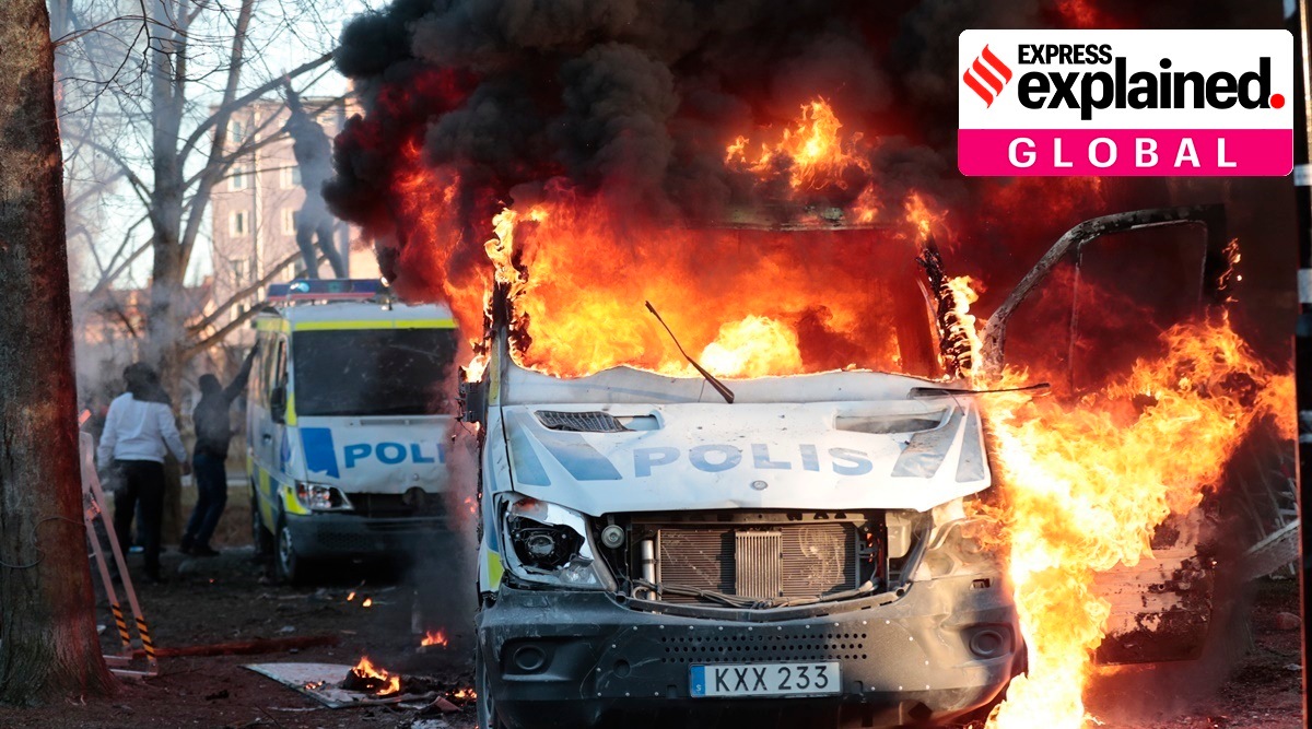Protesters set fire to a police bus in the park Sveaparken in Orebro, Sweden. (AP)
