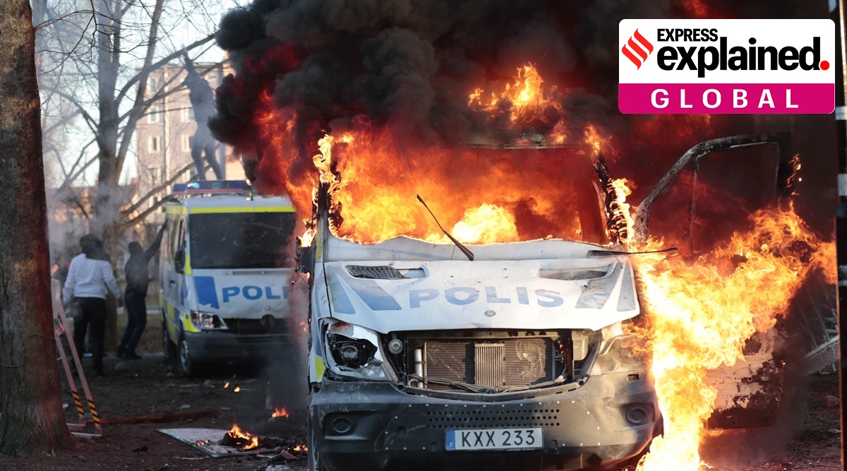 Protesters set fire to a police bus in the park Sveaparken in Orebro, Sweden. (AP)
