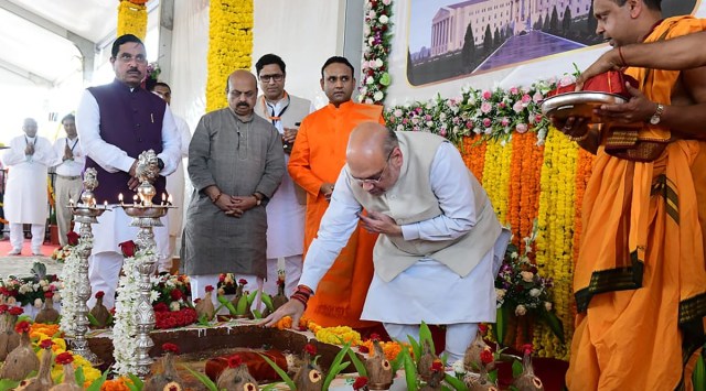 Union Home Minister Amit Shah, Karnataka CM Basavaraj Bommai and Parliamentary Affairs Minister Pralhad Joshi during 115th birth anniversary celebration of seer Shivakumara Swami, in Tumakuru. (PTI)
