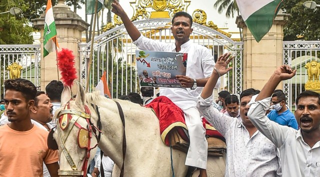 A Congress worker rides a horse during a protest against fuel price rise in Kolkata on Saturday. (PTI)