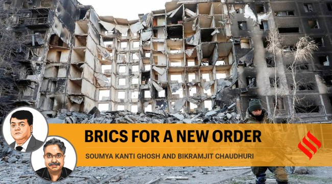 A service member of pro-Russian troops walks near an apartment building in the besieged southern port city of Mariupol. (Photo: AP)