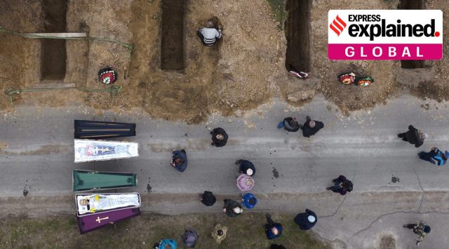 The bodies of people who died during the Russian occupation await burial during funerals in Bucha, on the outskirts of Kyiv, Wednesday, April 20, 2022. (AP Photo: Emilio Morenatti)
