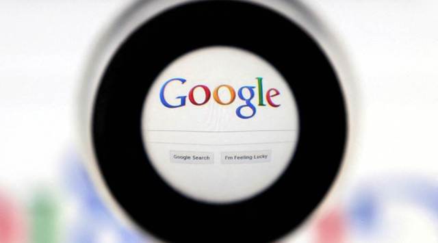 A Google search page is seen through a magnifying glass in this photo illustration taken May 30, 2014. (REUTERS/File Photo)