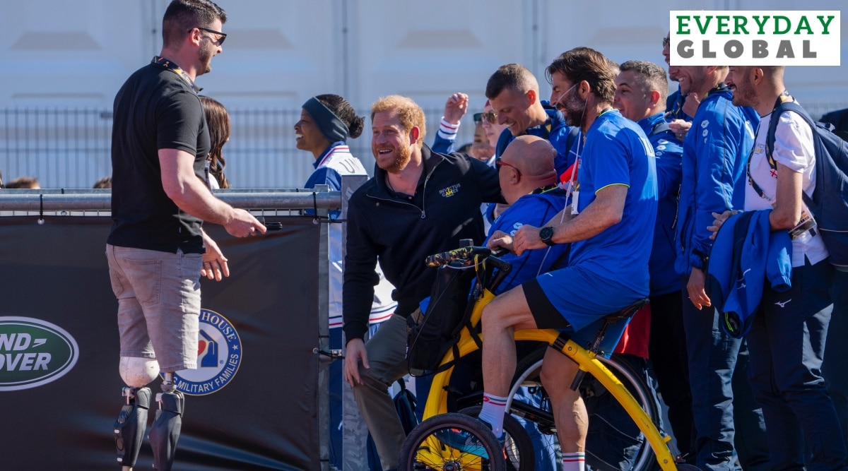 Prince Harry with members of Team Italy at the track and field event at the Invictus Games in The Hague, Netherlands, Sunday, April 17, 2022. (AP Photo/Peter Dejong)