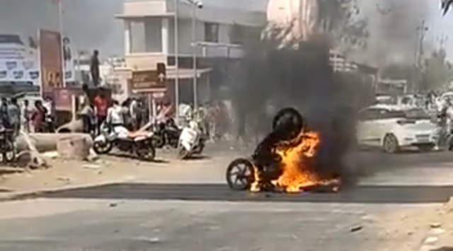 In Khambhat town, a clash broke out during a procession wherein stones were pelted and shops and vehicles were damaged by two groups (Screengrab from a video of the incident)