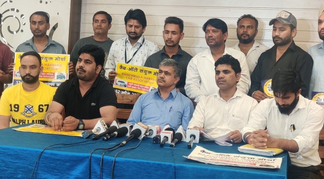 Members of the Cab Auto Sanyukt Morcha speak to the media, Saturday