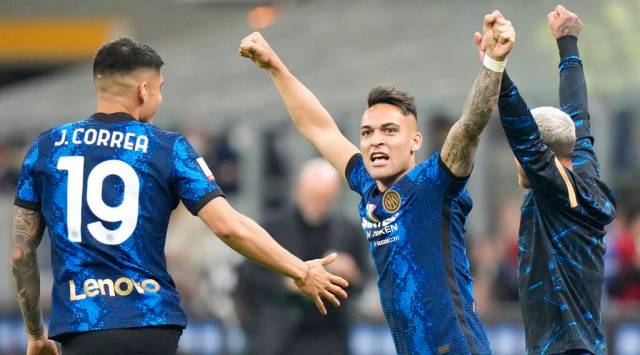 Inter Milan's Lautaro Martinez celebrates with teammates at the end of an Italian Cup semifinal. (AP Photo/Luca Bruno)