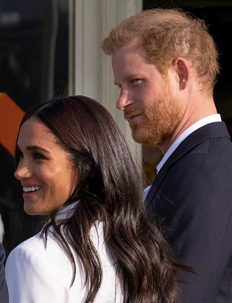 Meghan Markle, Meghan Markle news, Meghan Markle in Europe, Meghan Markle fashion, Meghan Markle back in Europe, Meghan Markle Invictus Games, Meghan Markle Valentino, Meghan Markle pantsuit, indian express news