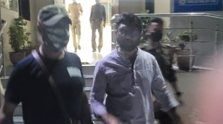Gujarat MLA Jignesh Mevani being taken into custody from a circuit house in Palanpur, Gujarat, on Wednesday night. (Photo: Twitter/@kanhaiyakumar)